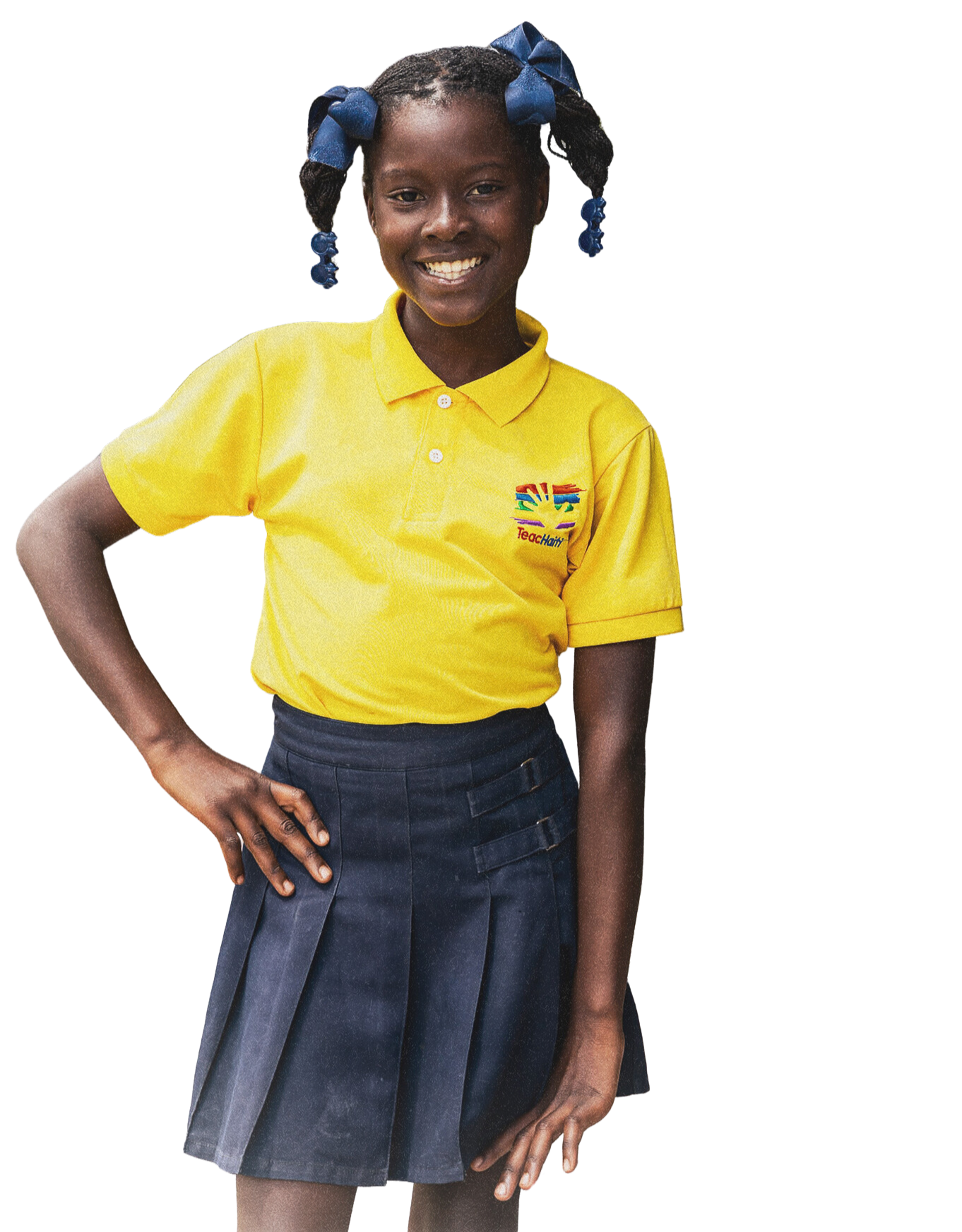 Haitian student wearing yellow Teach Haiti uniform.