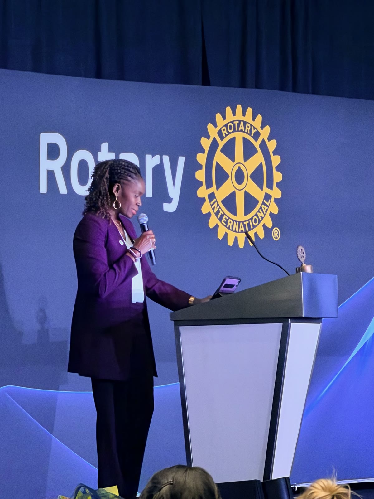 Miquette McMahon speaking at a Rotary International event